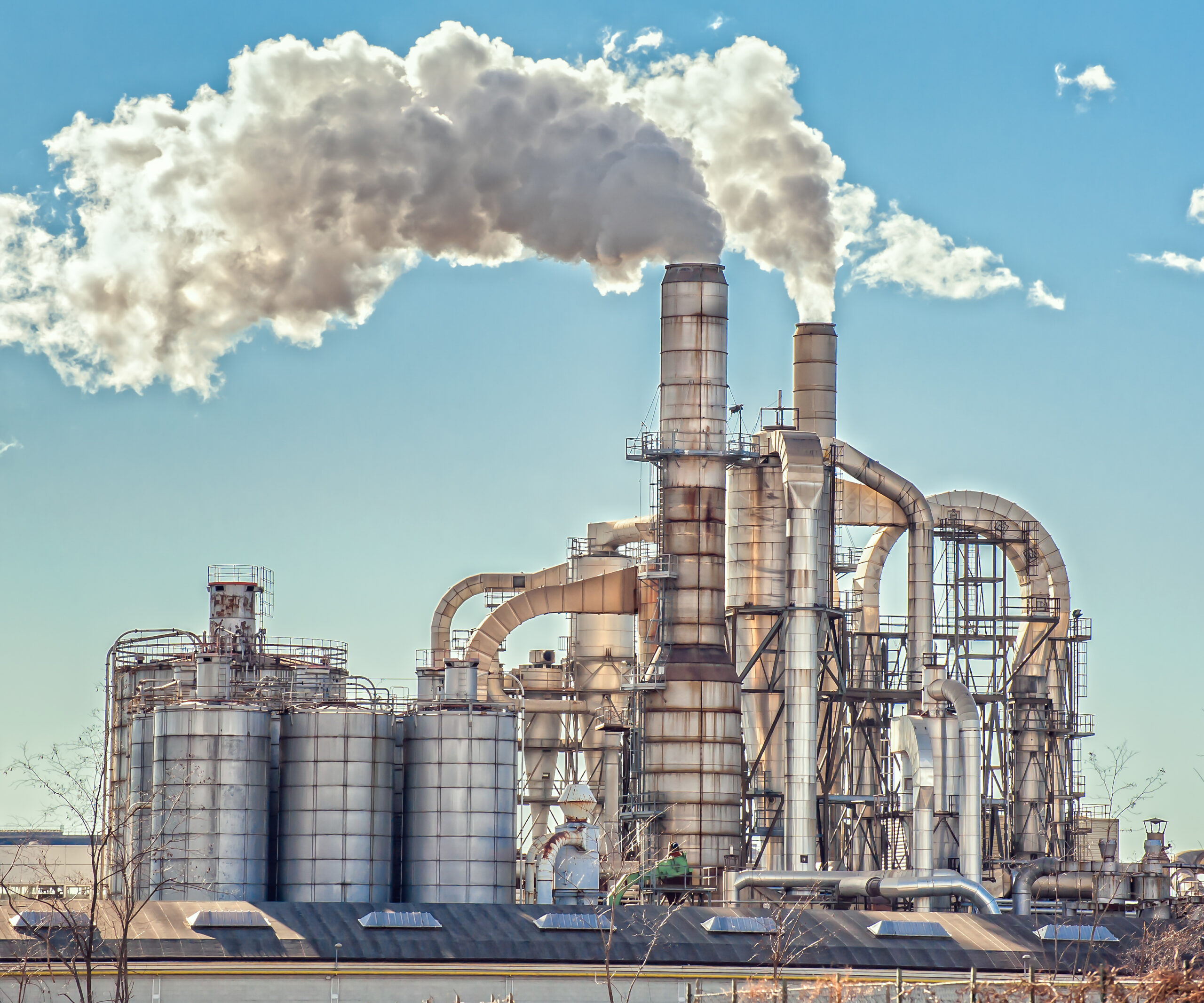 Chimneys and silos of a factory.